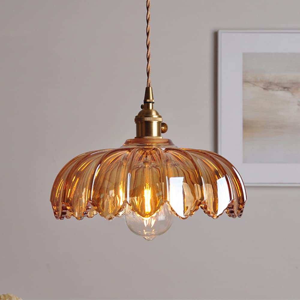 Vintage glass pendant light with a stylish copper finish, designed to provide soft ambient illumination for kitchen islands, enhancing rustic and modern decor. 0